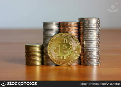 Bit coin in front of coins stack ,business concept