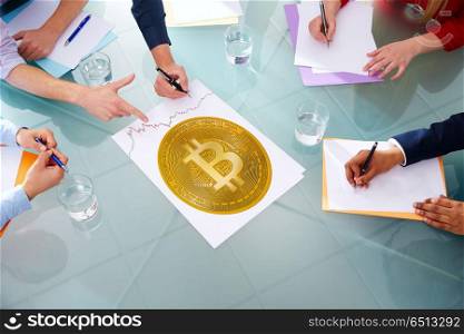 Bitcoin BTC business meeting with hands pointing. Bitcoin BTC business meeting with hands pointing to cryptocurrency