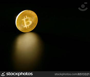 Bitcoin BTC coin reflection on the black soil. Bitcoin BTC coin reflection on the black soil background