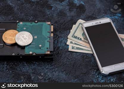 Bitcoin coin with HDD. Bitcoin coin on the HDD background
