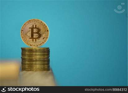 Bitcoin coins with blue background, one gold bitcoin on blue background