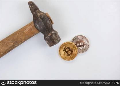 Bitcoin coins with hammer. Bitcoin coins with hammer on the white background