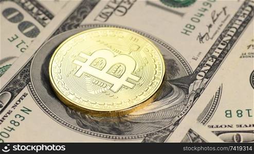 Bitcoin cryptocurrency replacing fiat currency. Seamless loop. Golden crypto coin against us dollars, rotating macro shot.. Golden bitcoin against us dollars