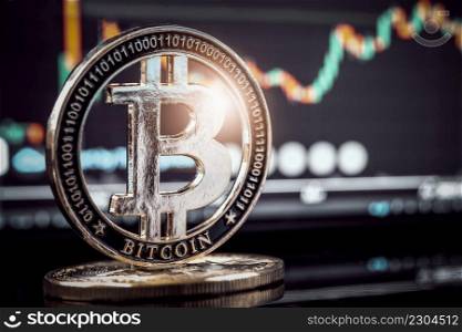 Bitcoin gold coin with Candle stick graph chart and digital background , financial investment concept and Mining Bitcoin cryptocurrency or blockchain technology