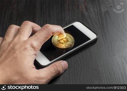 Bitcoin gold on the Smartphone. new cryptocurrency concept