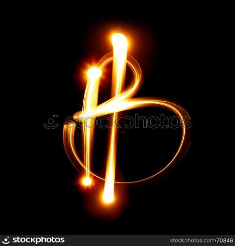 Bitcoin sign over black background. Light painting