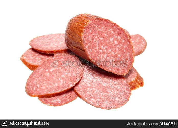 Bits of summer sausage isolated on white.