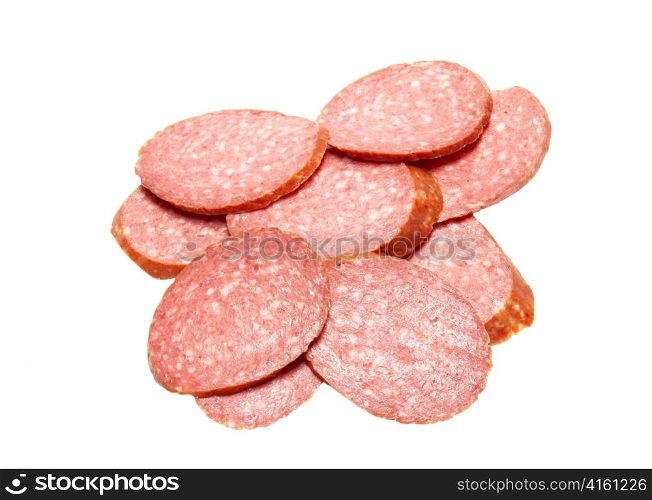 Bits of summer sausage isolated on white.