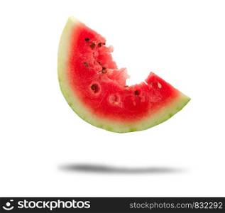 bitten off a piece of ripe red round watermelon with seeds on a white background