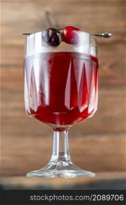 Bitter Jean Cocktail garnished with maraschino cherries