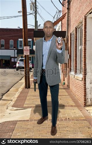 Black African American police detective man on the job with a gun