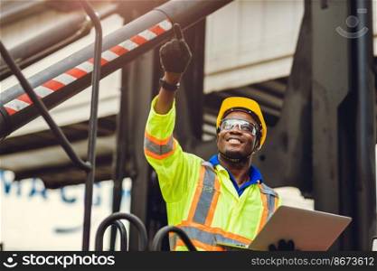 Black African American worker as staff foreman proud to happy smile working control loading cargo in shipping logistic warehouse with safety suit.