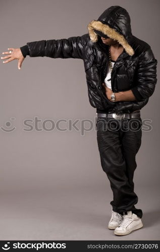 Black african rap performer on grey background