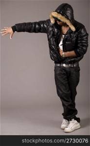 Black african rap performer on grey background