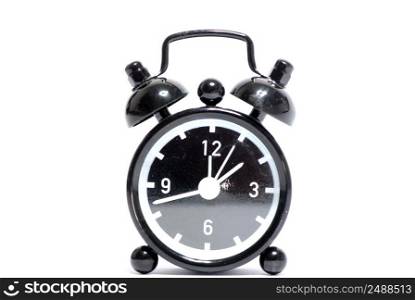Black alarm clock isolated on white background