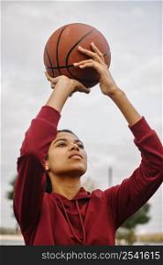 black american woman playing basketball