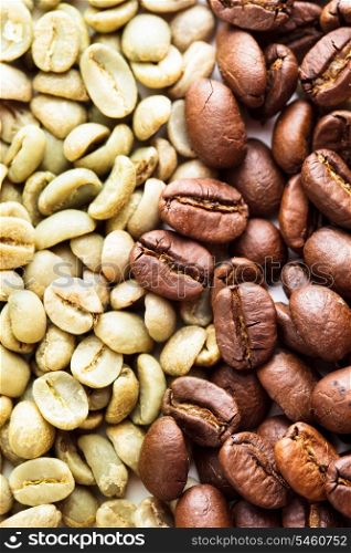 Black and green coffee beans as a background. Various types of coffee