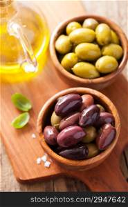 black and green marinated olives in bowls