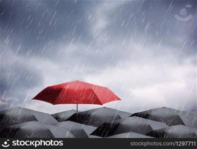Black and one red umbrellas under rain and thunderstorm