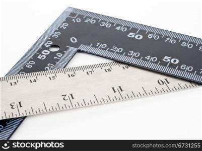 Black and silver metal measurement rulers on isolated on white background with copy space.