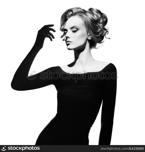 Black and white art fashion surrealistic portrait of beautiful woman with a beam of light on her face