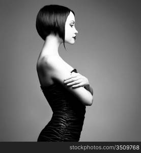 Black and white art photo. Elegant lady with stylish short hairstyle.