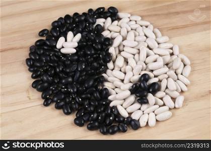 Black and white beans forming the yin-yang symbol