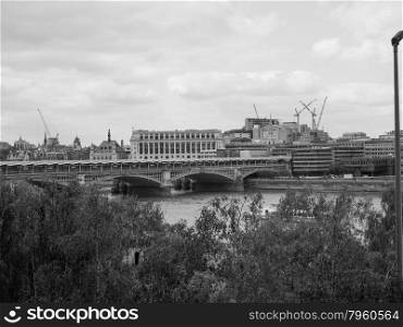Black and white Blackfriars bridge in London. Blackfriars Bridge over River Thames in London, UK in black and white