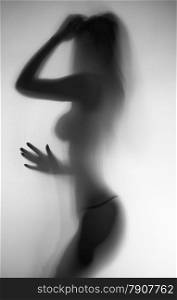 Black and white blurred photo of sexy slim naked woman