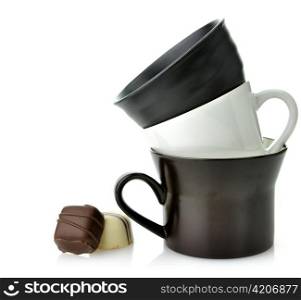 Black And White Ceramic Cups And Chocolate Candies