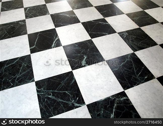 Black and white checked floor useful as a background. Checked floor