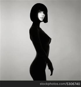 Black and white concept fashion photo of nude elegant woman wearing shadow. Brunette bob hairstyle. Fashion, Health and beauty