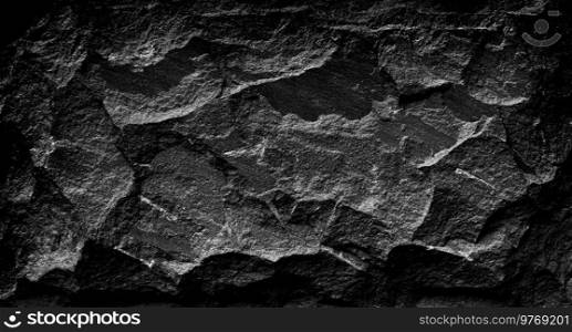 Black and white dark stone grunge background, rock wall with rough texture