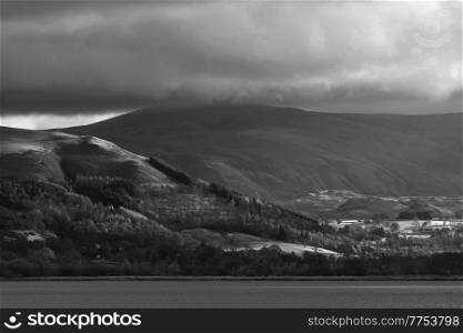 Black and white Epic landscape image across Bassenthwaite Lake in Lake District suring dramatic Autumn evening