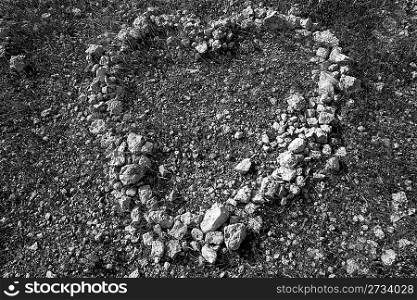 black and white heart shape stones on soil romantic and dramatic