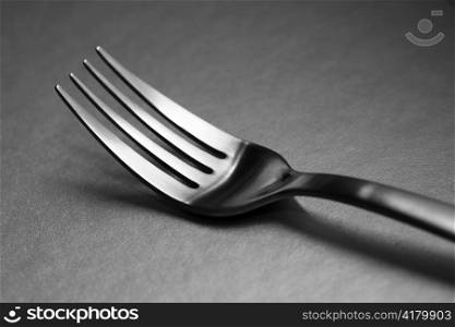 Black and white image of a fork. Very shallow depth-of field.