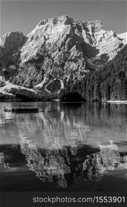 Black and white image of Lake Braies and its reflections, Italian landscape in South Tyrol