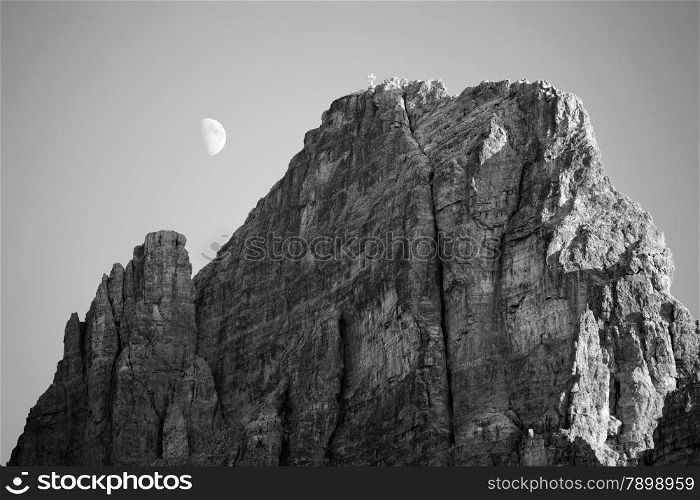 Black and white image of moon in Dolomites, Italy