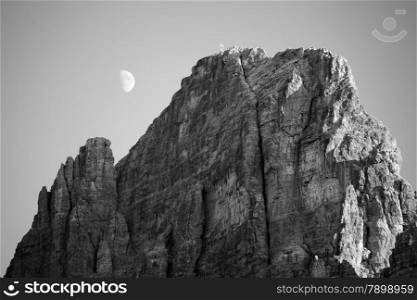 Black and white image of moon in Dolomites, Italy