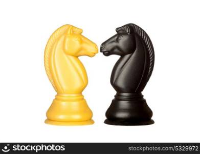 Black and white knights face to face. Symmetrical pieces of chess