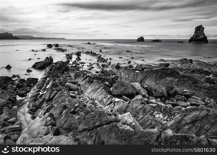 Black and white landscape of Mupe Bay with rocks in foreground