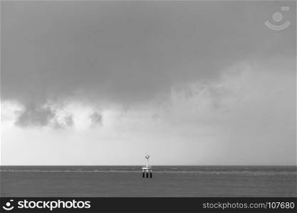 black and white lighthouse landscape in cloudy day