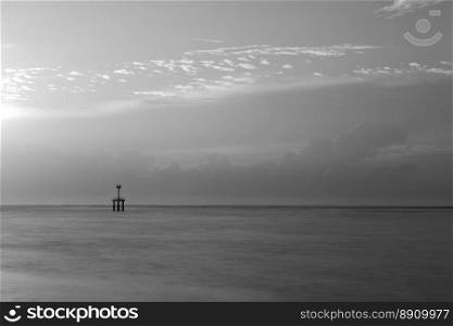 black and white lighthouse landscape in cloudy day with long exposure
