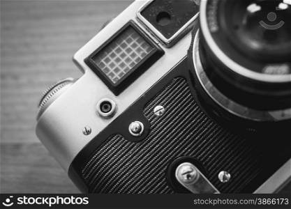 Black and white macro photo of retro camera viewfinder and lens
