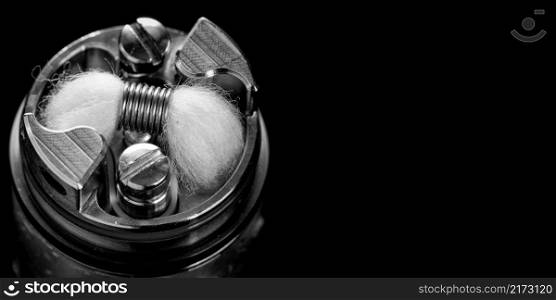 black and white, monochrome shot of single micro coil with japanese organic cotton wick in high end rebuildable dripping tank atomizer for flavour chaser, vaping device, vape gear, vaporizer equipment