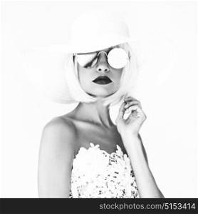 Black and white outdoor fashion photo of young beautiful lady in hat and sunglasses. Summer Beach travel. Summer vibes