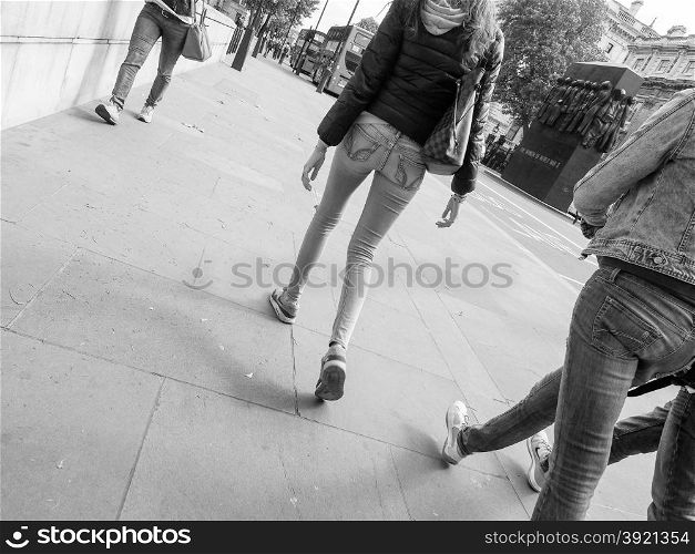 Black and white People walking. Unrecognisable people walking in urban scene in black and white