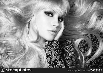 Black and white photo of beautiful woman with magnificent hair