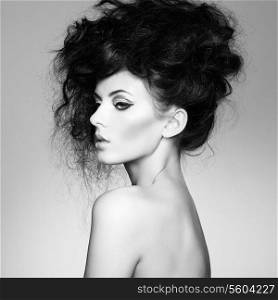 Black and white photo of beautiful woman with magnificent hair. Fashion photo