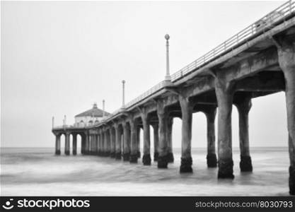 Black and white photo of Manhattan beach pier, California.
